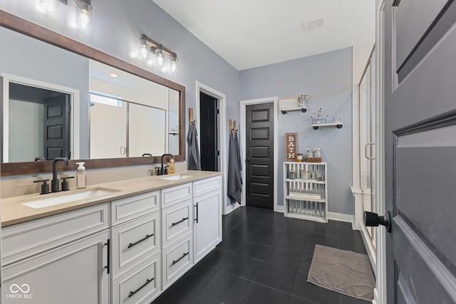 3599 Chalmers Dr, Bargersville, IN 46106 - full bath with tile patterned flooring, double vanity, a stall shower, and baseboards