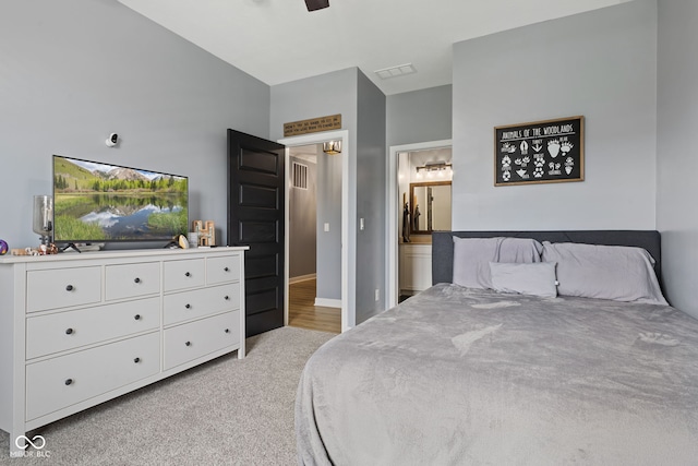 3599 Chalmers Dr, Bargersville, IN 46106 - bedroom with light carpet, connected bathroom, and baseboards