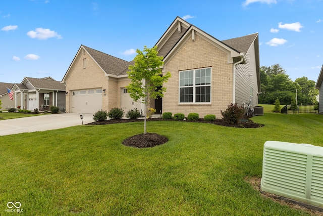 3599 Chalmers Dr, Bargersville, IN 46106 - view of front of home with central AC, driveway, a garage, brick siding, and a shingled roof