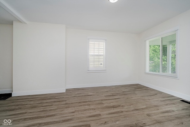 1038 W 33rd St, Indianapolis, IN 46208 - unfurnished room with healthy amount of natural light and wood finished floors