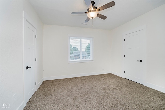 1038 W 33rd St, Indianapolis, IN 46208 - empty room featuring carpet flooring and a ceiling fan