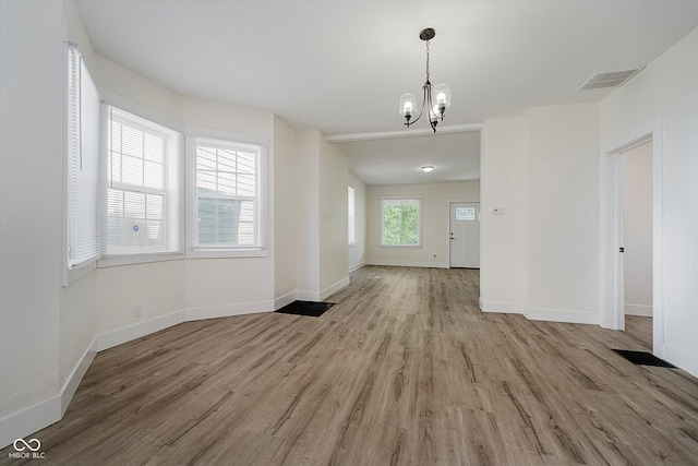 1038 W 33rd St, Indianapolis, IN 46208 - unfurnished dining area with light wood-type flooring and a chandelier