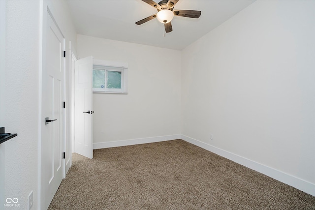 1038 W 33rd St, Indianapolis, IN 46208 - carpeted empty room with a ceiling fan and baseboards