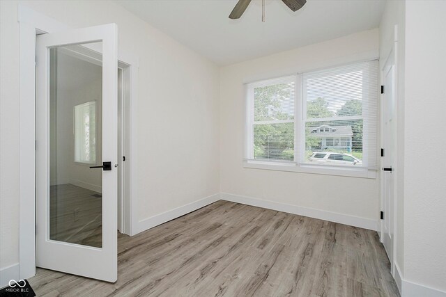 1038 W 33rd St, Indianapolis, IN 46208 - empty room featuring light wood-type flooring and a ceiling fan