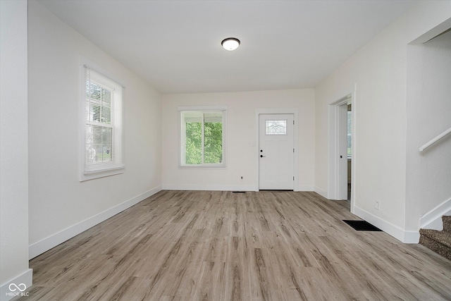1038 W 33rd St, Indianapolis, IN 46208 - entrance foyer featuring light wood-style flooring, plenty of natural light, and stairway