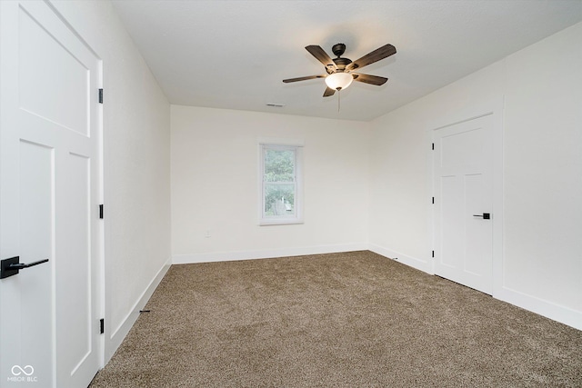 1038 W 33rd St, Indianapolis, IN 46208 - spare room featuring carpet and a ceiling fan