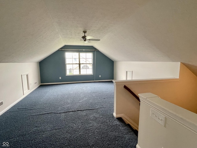 125 Bridgemor Ln, Mooresville, IN 46158 - additional living space with carpet, baseboards, lofted ceiling, a textured ceiling, and ceiling fan