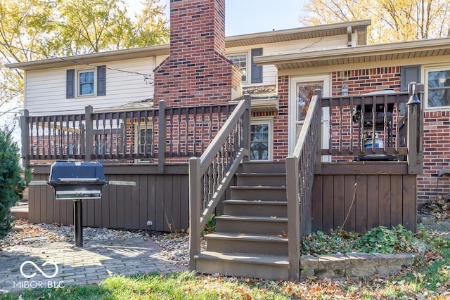 2457 N Centerline Rd, Franklin, IN 46131 - rear view of property featuring a deck, brick siding, stairway, and a chimney