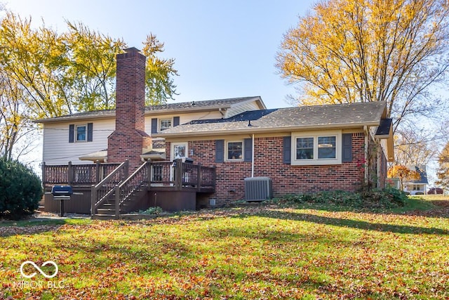 2457 N Centerline Rd, Franklin, IN 46131 - back of house featuring brick siding, a yard, a wooden deck, a chimney, and central air condition unit