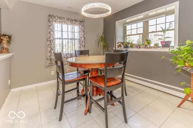 2457 N Centerline Rd, Franklin, IN 46131 - dining space with baseboards, a baseboard heating unit, and light tile patterned flooring