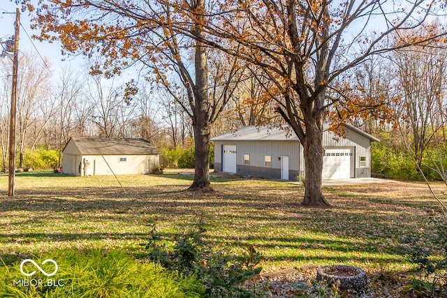 2457 N Centerline Rd, Franklin, IN 46131 - view of grassy yard with an outdoor structure and a detached garage