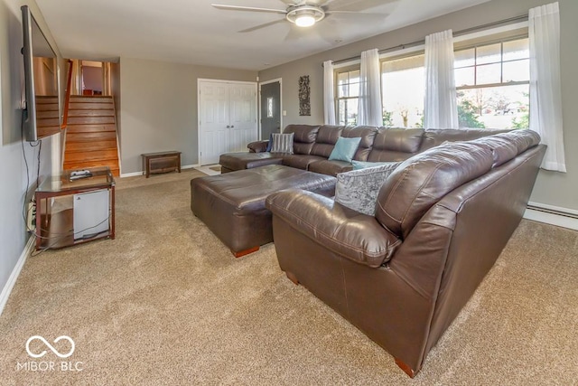 2457 N Centerline Rd, Franklin, IN 46131 - living room featuring carpet flooring, a ceiling fan, baseboards, and stairway