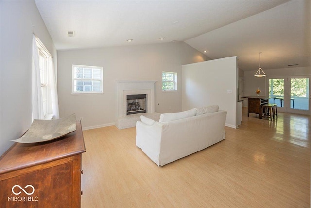 11830 Sand Creek Blvd, Fishers, IN 46037 - living room with light wood-style floors, a fireplace, and lofted ceiling