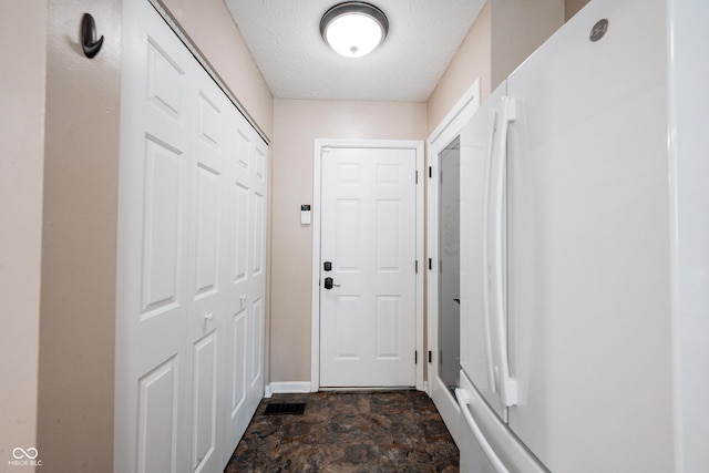 7686 Micawber Ct, Indianapolis, IN 46256 - entryway featuring stone finish flooring and a textured ceiling