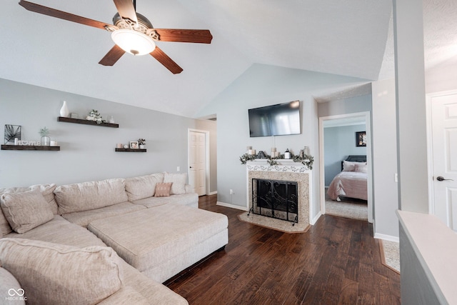 7686 Micawber Ct, Indianapolis, IN 46256 - living area with vaulted ceiling, a ceiling fan, wood finished floors, and a fireplace