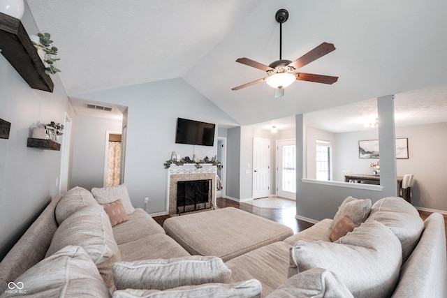 7686 Micawber Ct, Indianapolis, IN 46256 - living room featuring a fireplace, lofted ceiling, a ceiling fan, and wood finished floors