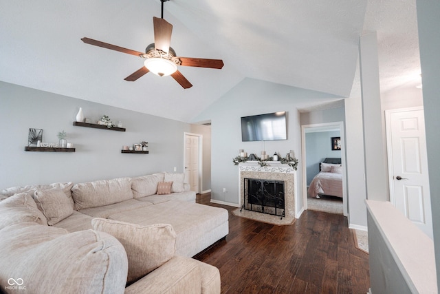 7686 Micawber Ct, Indianapolis, IN 46256 - living area with ceiling fan, dark wood finished floors, vaulted ceiling, and a fireplace