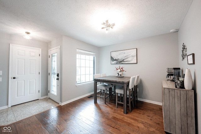 7686 Micawber Ct, Indianapolis, IN 46256 - dining area with a textured ceiling and wood finished floors