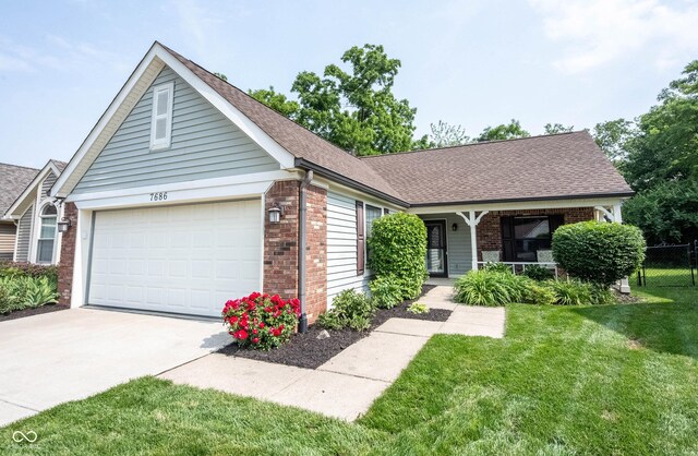 7686 Micawber Ct, Indianapolis, IN 46256 - view of front of property with brick siding, concrete driveway, covered porch, a shingled roof, and an attached garage