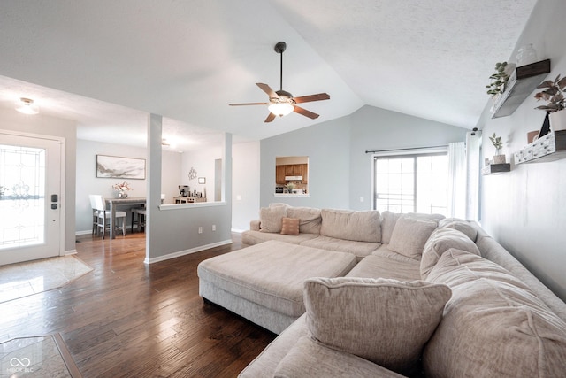 7686 Micawber Ct, Indianapolis, IN 46256 - living room featuring dark wood finished floors, ceiling fan, and vaulted ceiling