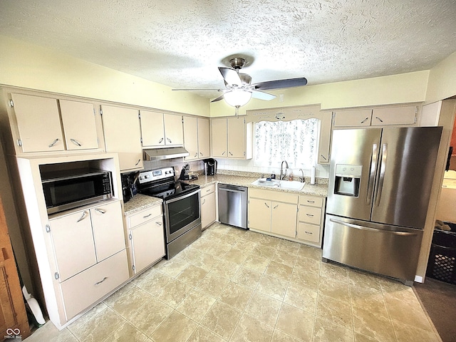 22 Brooklyn Ct, Mooresville, IN 46158 - kitchen featuring stainless steel appliances, a sink, under cabinet range hood, a ceiling fan, and a textured ceiling