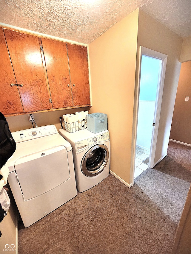 22 Brooklyn Ct, Mooresville, IN 46158 - washroom featuring cabinet space, washer and clothes dryer, carpet floors, a textured ceiling, and baseboards
