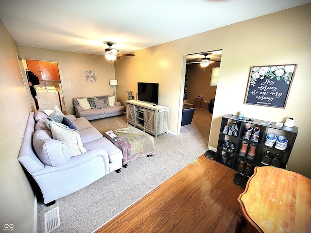 22 Brooklyn Ct, Mooresville, IN 46158 - living room with ceiling fan, washer / clothes dryer, wood finished floors, and baseboards