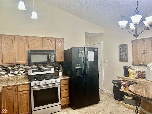 108 Meadowview Dr, Mooresville, IN 46158 - kitchen featuring black appliances, backsplash, a chandelier, lofted ceiling, and light countertops