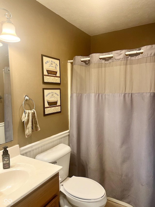 108 Meadowview Dr, Mooresville, IN 46158 - bathroom with vanity, toilet, wainscoting, and a shower with curtain