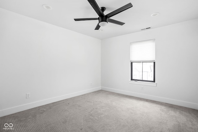 1717 Carrollton Ave, Indianapolis, IN 46202 - carpeted empty room with baseboards and ceiling fan