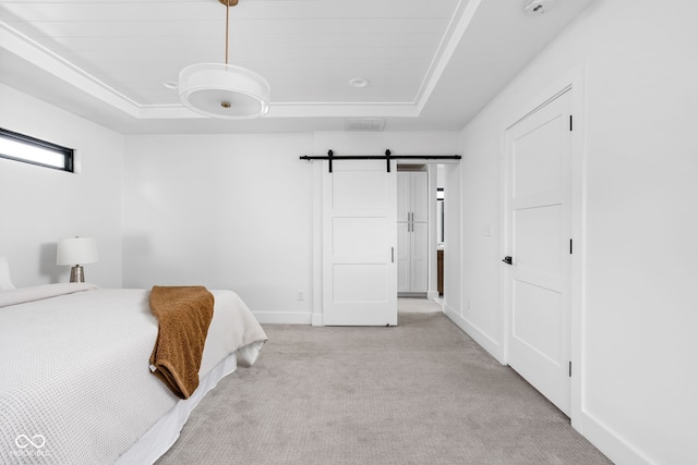 1717 Carrollton Ave, Indianapolis, IN 46202 - bedroom with a tray ceiling, light colored carpet, and a barn door