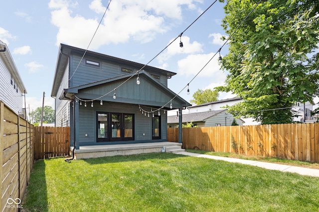 1717 Carrollton Ave, Indianapolis, IN 46202 - rear view of house with a fenced backyard and covered porch