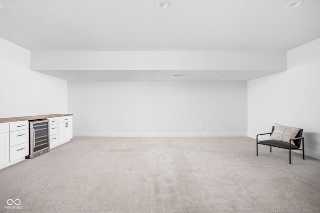 1717 Carrollton Ave, Indianapolis, IN 46202 - unfurnished room with wine cooler, light carpet, a dry bar, and recessed lighting