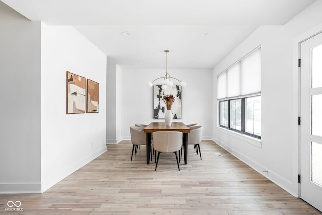 1717 Carrollton Ave, Indianapolis, IN 46202 - dining area with a chandelier, light wood-style floors, and recessed lighting