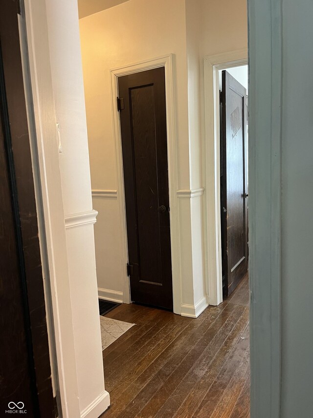 26 Oakwood Ave, North Vernon, IN 47265 - hallway featuring dark wood-style floors and baseboards