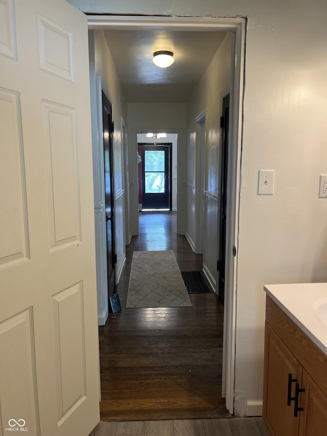 26 Oakwood Ave, North Vernon, IN 47265 - hall featuring dark wood-type flooring and baseboards