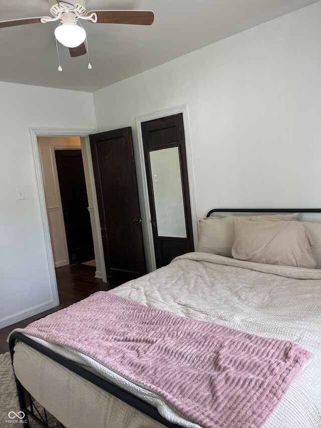 26 Oakwood Ave, North Vernon, IN 47265 - bedroom featuring dark wood-style flooring, ceiling fan, and baseboards