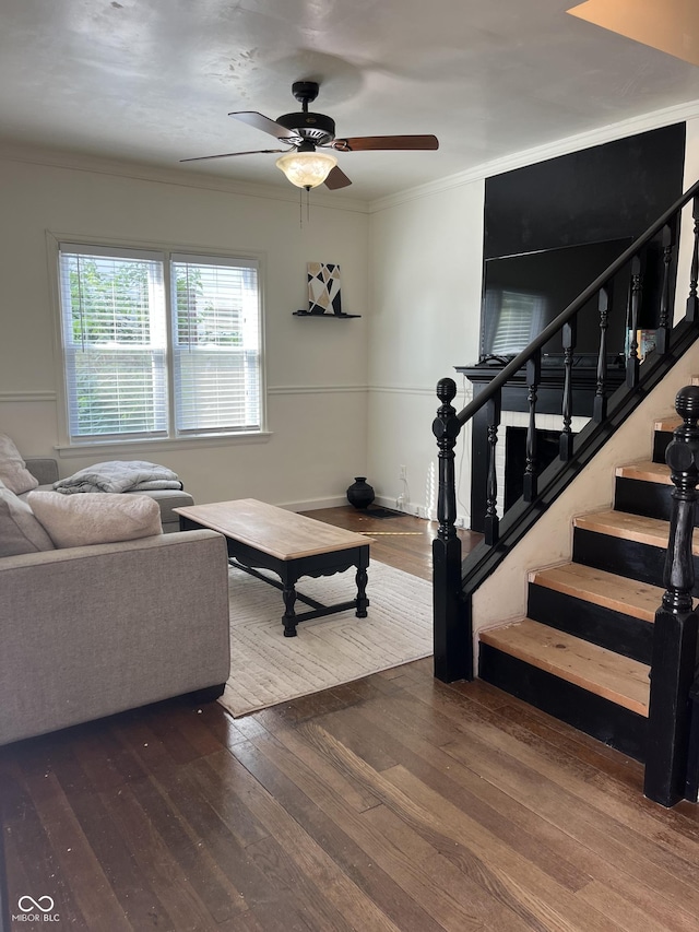26 Oakwood Ave, North Vernon, IN 47265 - living room with hardwood / wood-style floors, ceiling fan, stairway, crown molding, and baseboards