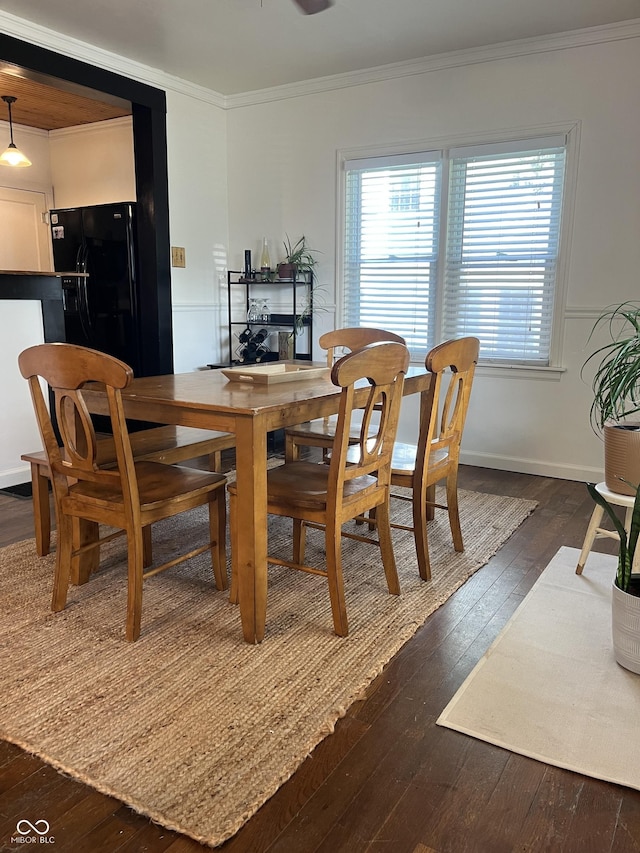 26 Oakwood Ave, North Vernon, IN 47265 - dining area featuring ornamental molding, dark wood-style floors, and plenty of natural light