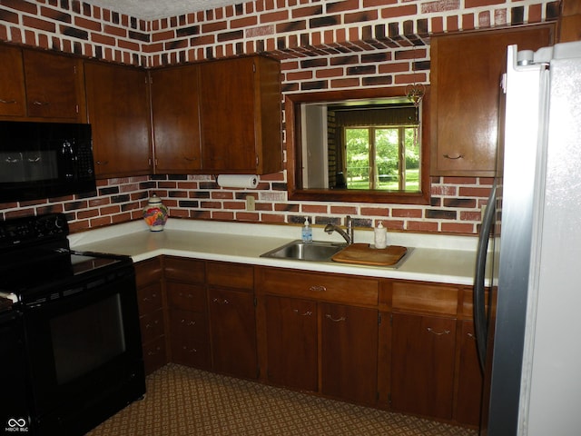 1796 N 400 W, Crawfordsville, IN 47933 - kitchen with black appliances, light countertops, a sink, and decorative backsplash