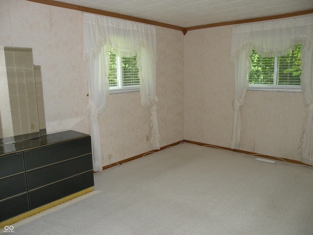 1796 N 400 W, Crawfordsville, IN 47933 - unfurnished room featuring ornamental molding, healthy amount of natural light, light colored carpet, and wallpapered walls