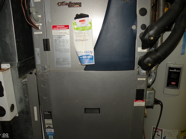 1796 N 400 W, Crawfordsville, IN 47933 - utility room featuring heating unit and water heater