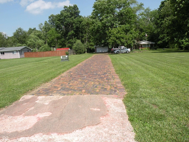 1796 N 400 W, Crawfordsville, IN 47933 - view of yard featuring decorative driveway and view of scattered trees