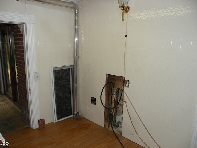 1796 N 400 W, Crawfordsville, IN 47933 - laundry area featuring wood finished floors and tile walls