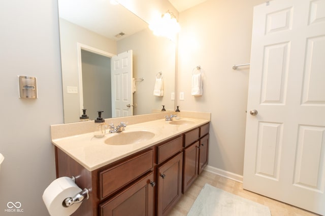 226 S Cave Creek Dr S, Bloomington, IN 47403 - full bath featuring double vanity, baseboards, and tile patterned flooring