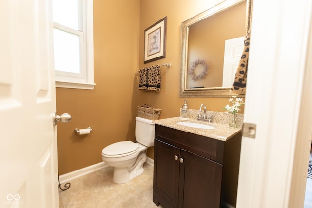 226 S Cave Creek Dr S, Bloomington, IN 47403 - bathroom with baseboards, toilet, vanity, and tile patterned flooring