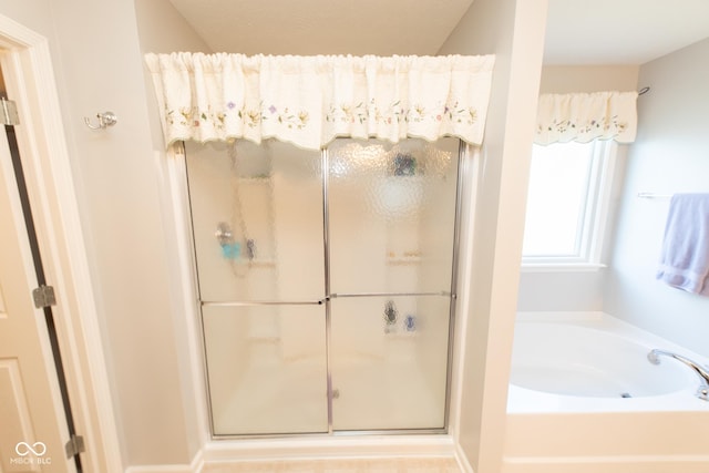 226 S Cave Creek Dr S, Bloomington, IN 47403 - full bathroom featuring a stall shower and a garden tub