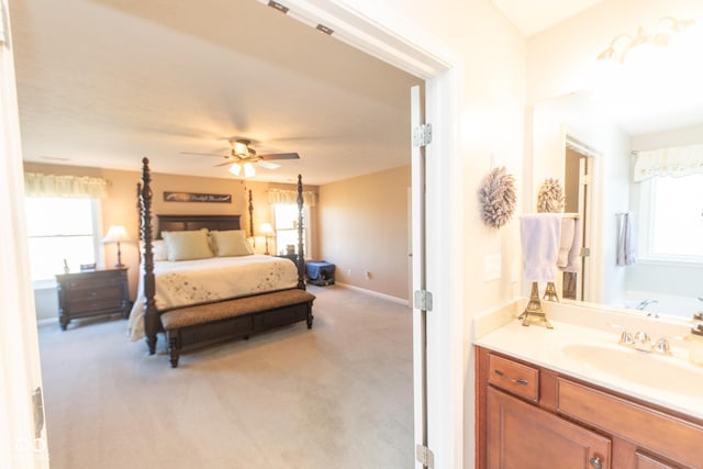 226 S Cave Creek Dr S, Bloomington, IN 47403 - bedroom featuring light colored carpet, a sink, baseboards, and ensuite bath