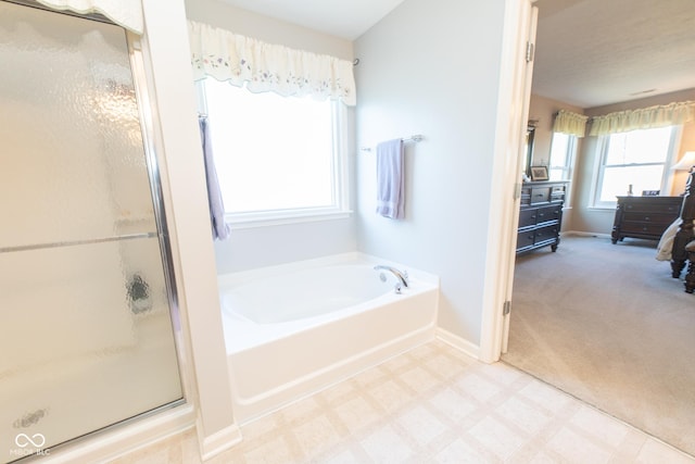 226 S Cave Creek Dr S, Bloomington, IN 47403 - bathroom with a bath, a shower stall, baseboards, and tile patterned floors
