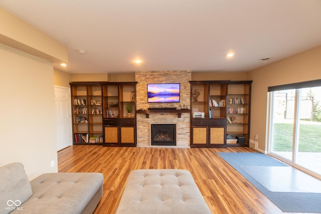 226 S Cave Creek Dr S, Bloomington, IN 47403 - living area with a fireplace, light wood-style floors, and recessed lighting